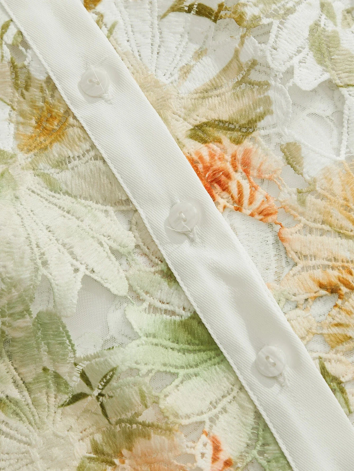 Leichte, luxuriöse und vielseitige Damenbluse mit Lochmuster und Druckmotiv