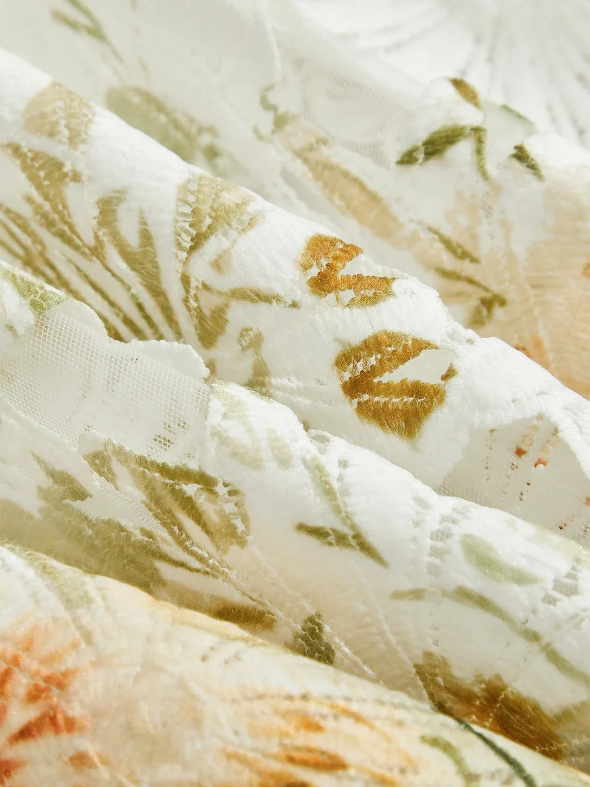 Leichte, luxuriöse und vielseitige Damenbluse mit Lochmuster und Druckmotiv